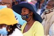 Member of the community of Dinokana Lehurutse Village listening to Ministers address 011